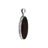 Sterling silver oval pendant with black shell and hammered silver frame handcrafted in Bali